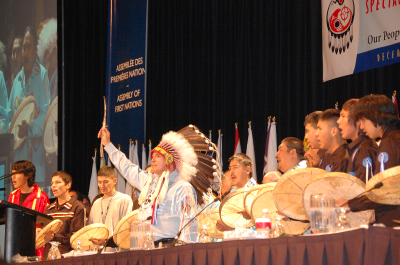 Treaty 7 Northern Dene drummers surrounded National Chief Perry Bellegarde