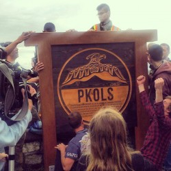 Organizers and elders raised a carved wood sign restoring the traditional name P
