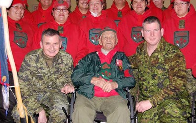 Pictured is ranger Abraham Metatawabin with Canadian Rangers and military office