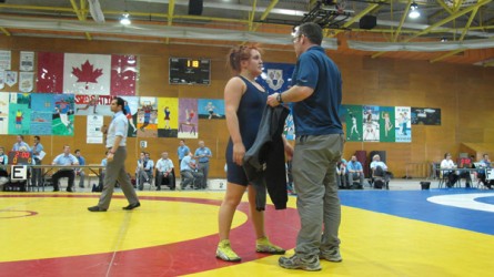 Daley Forbes speaks with her coach James Messanger