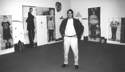 Kim McLain with student artwork in 1998.