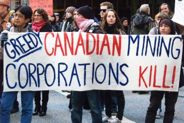 Protestors march in Vancouver against mining expansion