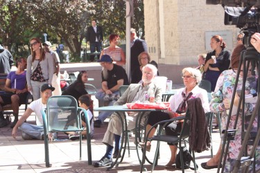 Various people listening to the speakers talk about overdose awareness