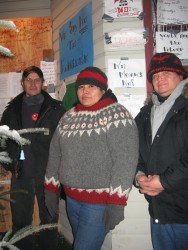 Dan Yunkwas, Melanie Smoke and Mark Smoke stand outside the boarded up Gitxan Tr