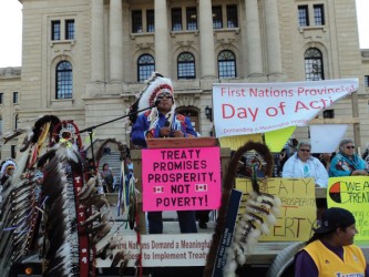 Chief Larry Cachene from the Yellow Quill First Nation addresses a crowd of more
