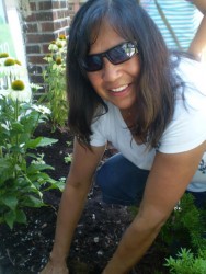 Wendy Sickles does some weeding with the Turtle Island Garden Club.