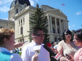 Chief Lyle Whitefish fields questions from reporters outside the legislative bui