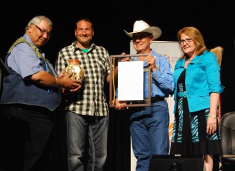 Gilles Dorval (second from left) is recognized by Truth and Reconciliation Commi