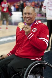 Richard Peter shows off his gold medal