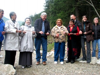 Chief James Hobart (left) of the Spuzzum First Nation looks on as Senator Lillia