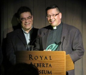 Rev. Travis Enright (right) accepts the Interfaith Advocate Award 