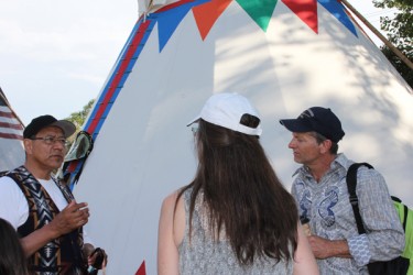 Tipi owner Duane Mark educates Indian Village visitors at the Calgary Stampede.
