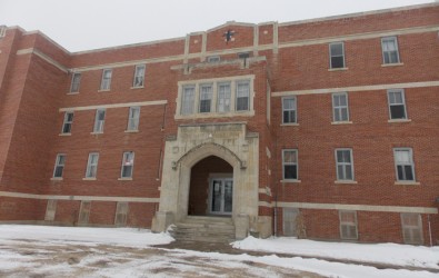 The Blue Quills building had a concrete cross located centered on the roof above