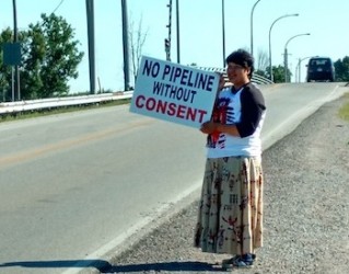 Protestor Lindsay Gray from Aamjiwnaang First Nation on Walpole Island bridge 