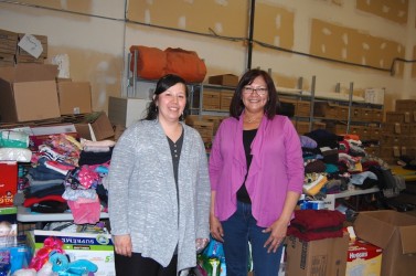 Jackie Alook (left) and Debra Loyie with donations coming into Treaty 8