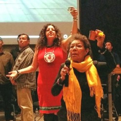 Organizer Suzanne Smoke (left) and Elder Jackie Lavalley offering a prayer for t