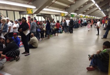 Line up of evacuees at UofA Butterdome- Travis McEwan CBC Twitter