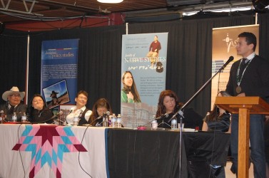 At the podium Wab Kinew is joined on the panel (from left) by Samson Elder Cecil